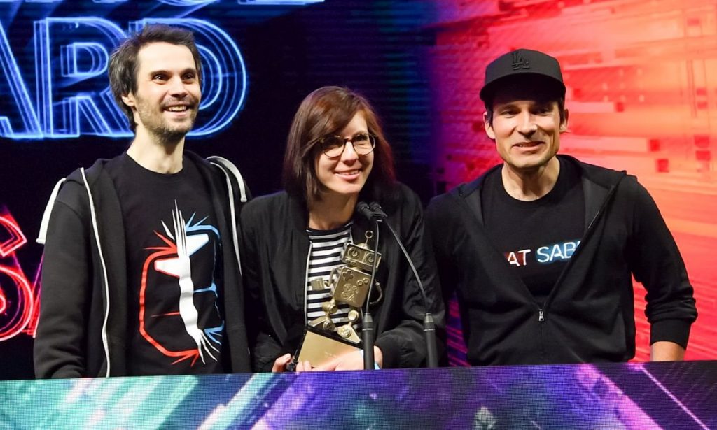 Three members of the Beat Saber team on stage at the 2019 Game Developers Choice Awards