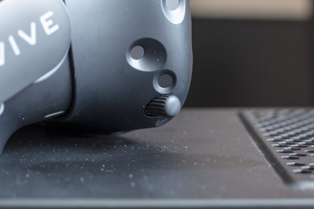 Close-up of the interpupillary distance adjustment knob on an HTC Vive headset