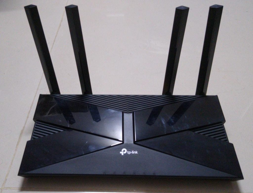 Front of a black TP-Link Wi-Fi 6 router with external antennas