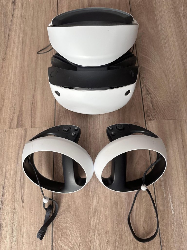 PlayStation VR2 headset with its two Sense controllers