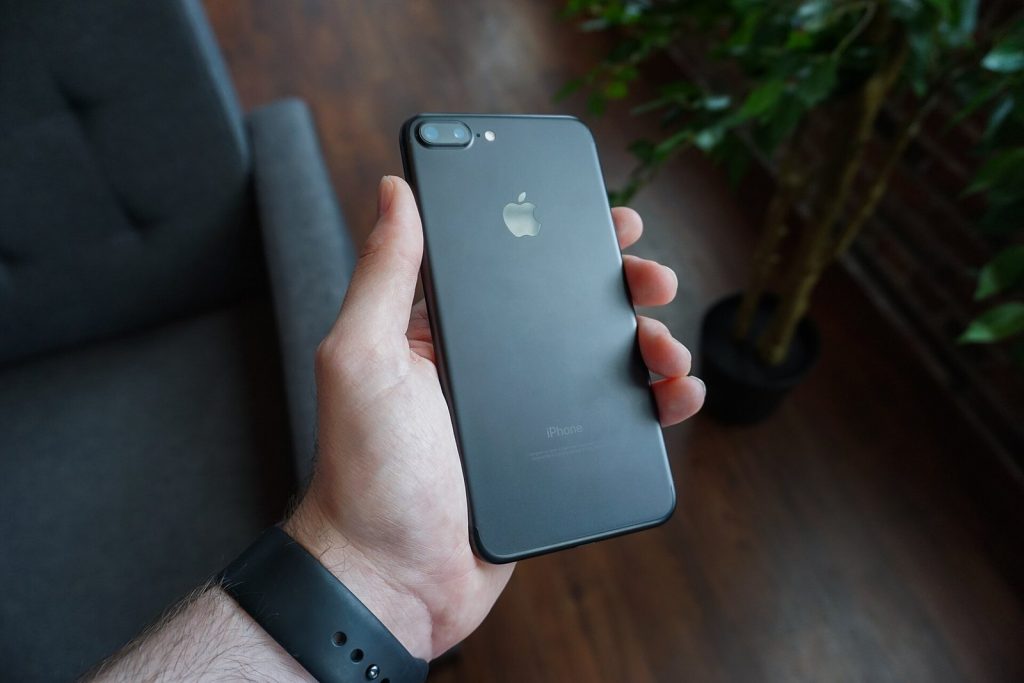 Hand holding a black smartphone