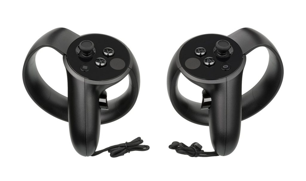 Pair of black Oculus Touch motion controllers with thumbsticks, buttons and tracking rings